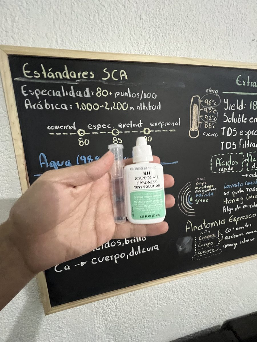 API GH & KH kit: KH reagent bottle and test tube, with SCA standards chalkboard in background